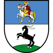 Wappen von Bockenheim. Obere Hälfte blau, darauf ein Reiter mit rotem Mantel mit weißem Pferd. Untere Hälfte weiß, darauf ein steigender schwarzer Bock auf grünem Hügel. 