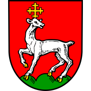 Wappen von Mertesheim. Auf Rot ein weißes Lamm mit Kreuz über dem Kopf auf grünem Boden. 