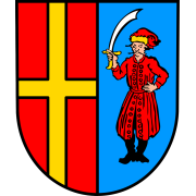 Wappen von Wattenheim. Linke Hälfte ein gelbes Kreuz auf rotem Grund. Rechte Hälfte ein rotgekleideter Mann mit einem Säbel auf Hellblau. 