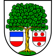 Wappen von Ellerstadt. Weißer Hintergrund. Auf grünem Boden ein grüner Baum mit gelbem Stamm. Links vom Stamm ein quer blau, weiß und rot gestreiftes Wappenschild, rechts vom Stamm ein weißes Wappenschild mit rotem Querbalken und drei roten Kreisen. 